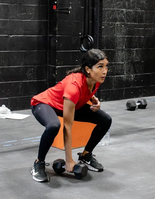 Woman training with dumbbells at StillPoint Fitness